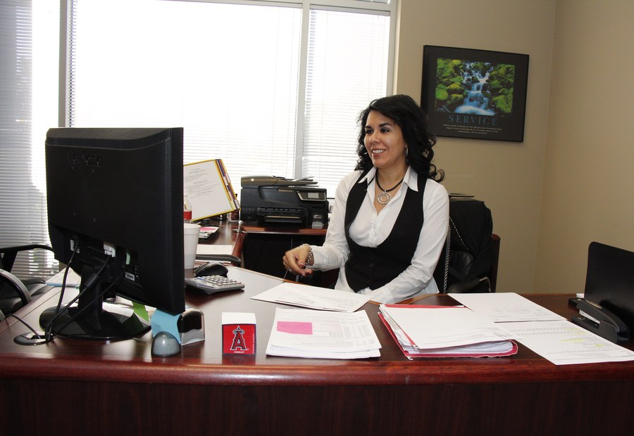 Claudia at her desk